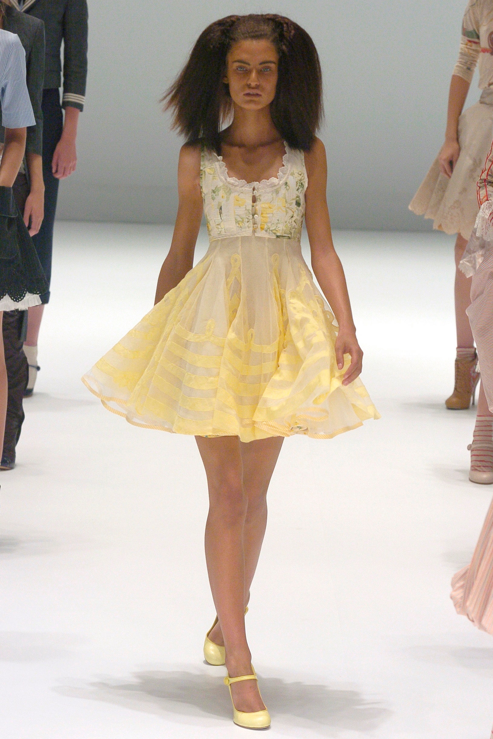 yellow pleated sleeveless dress