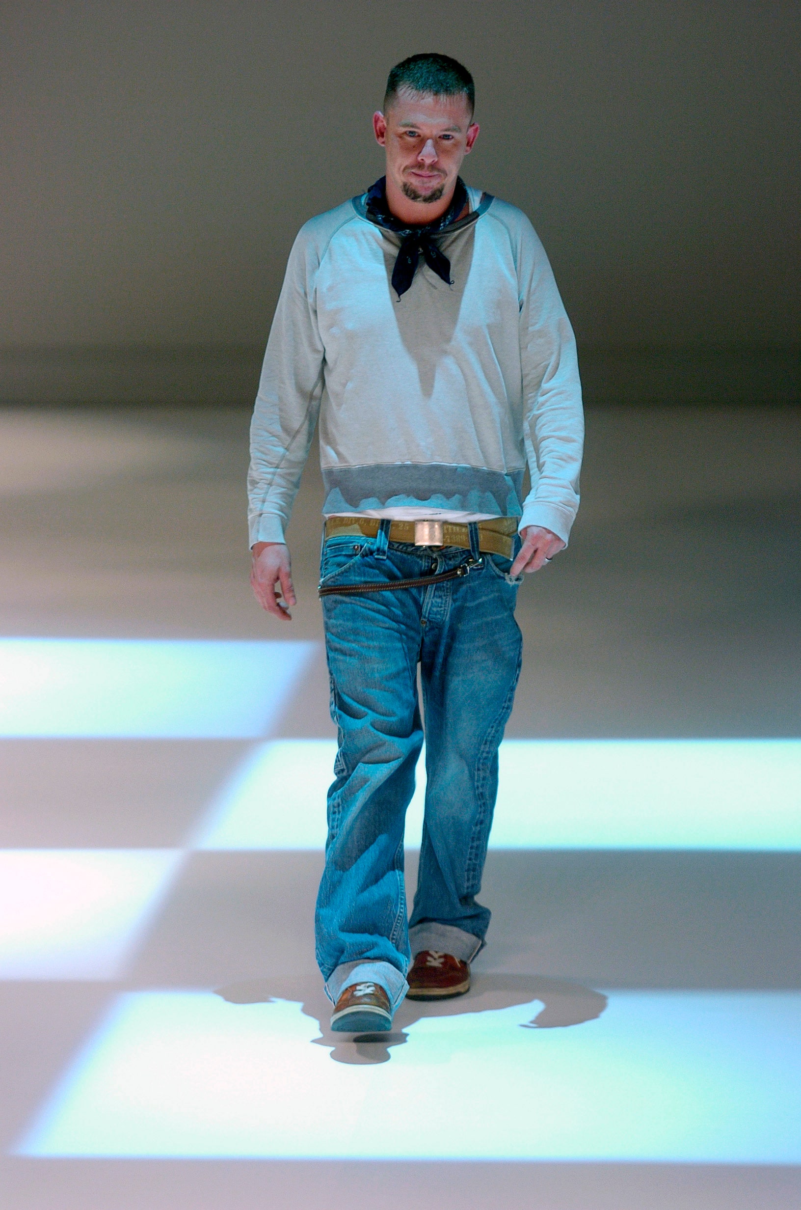 gray relaxed sweater and blue jeans