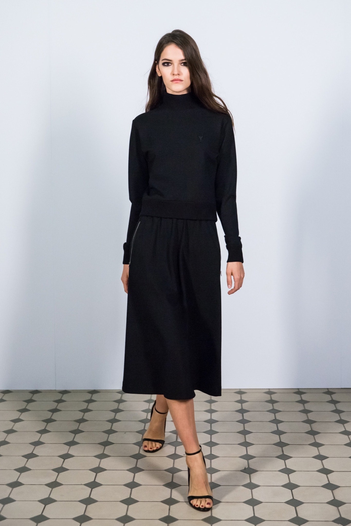 black fitted top and midi skirt