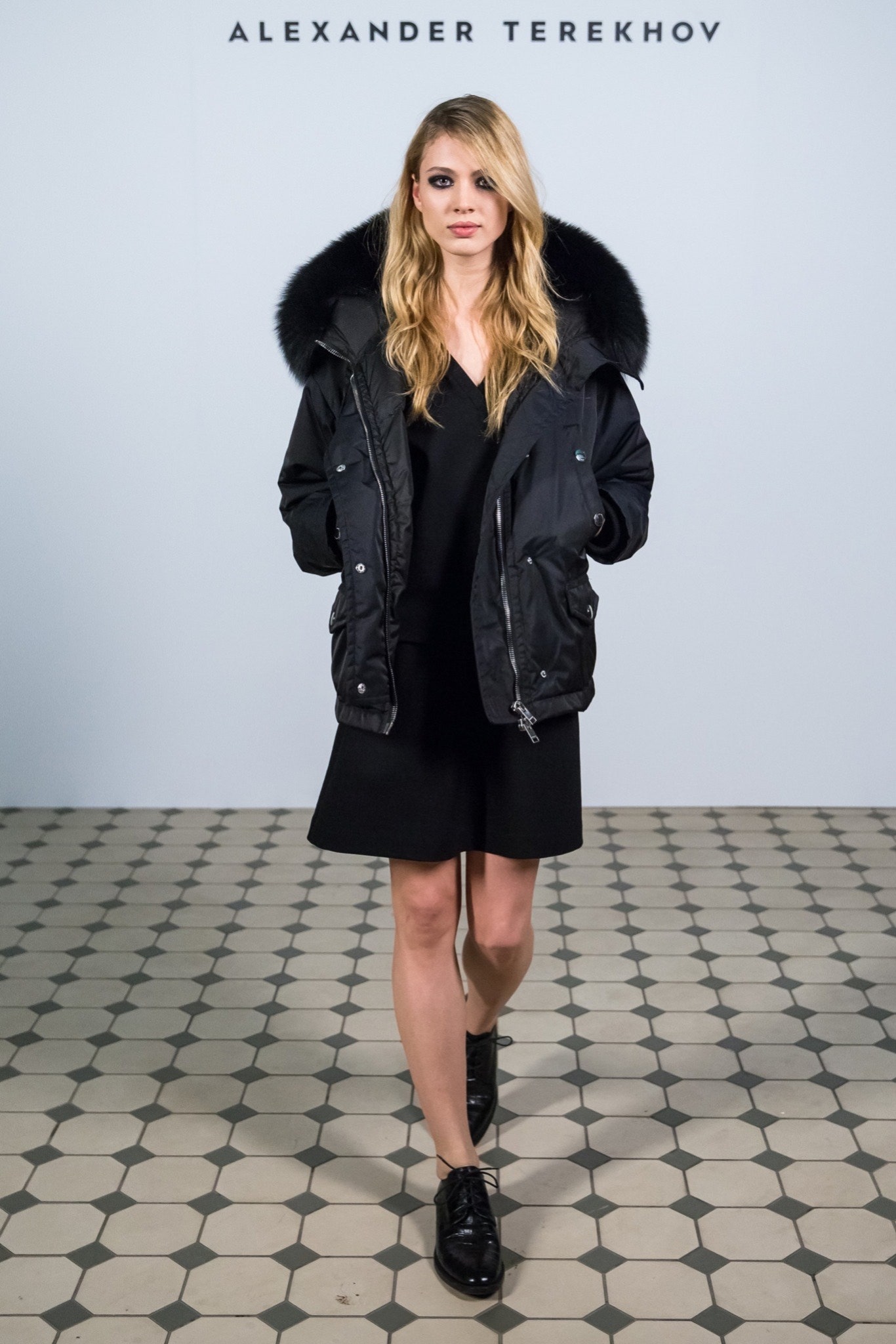 black jacket over black dress