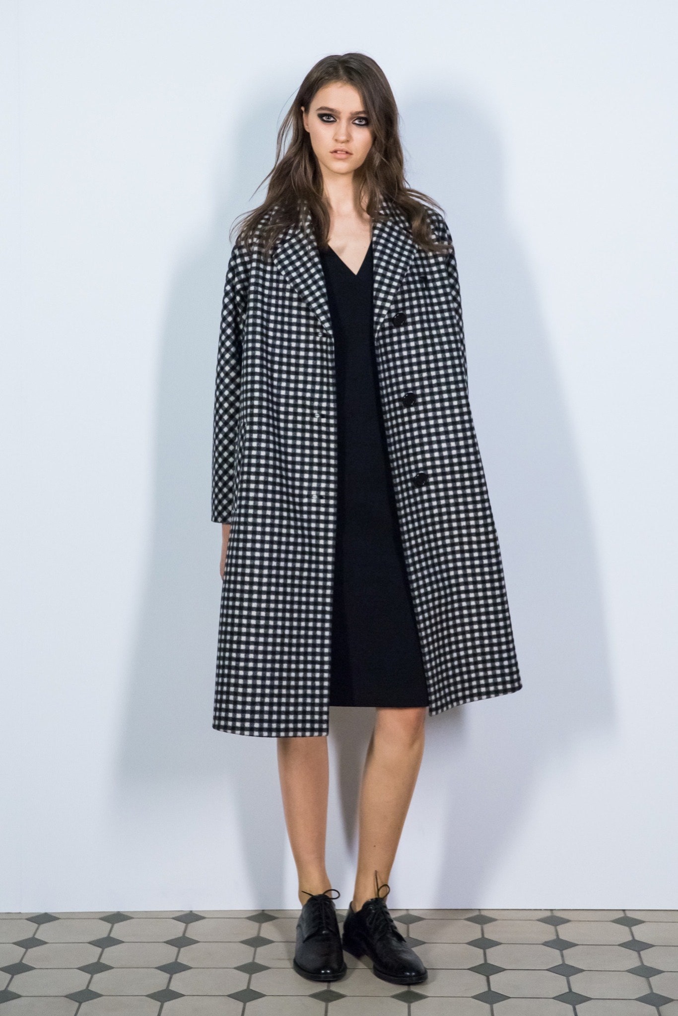 checked black and white coat with fitted dress