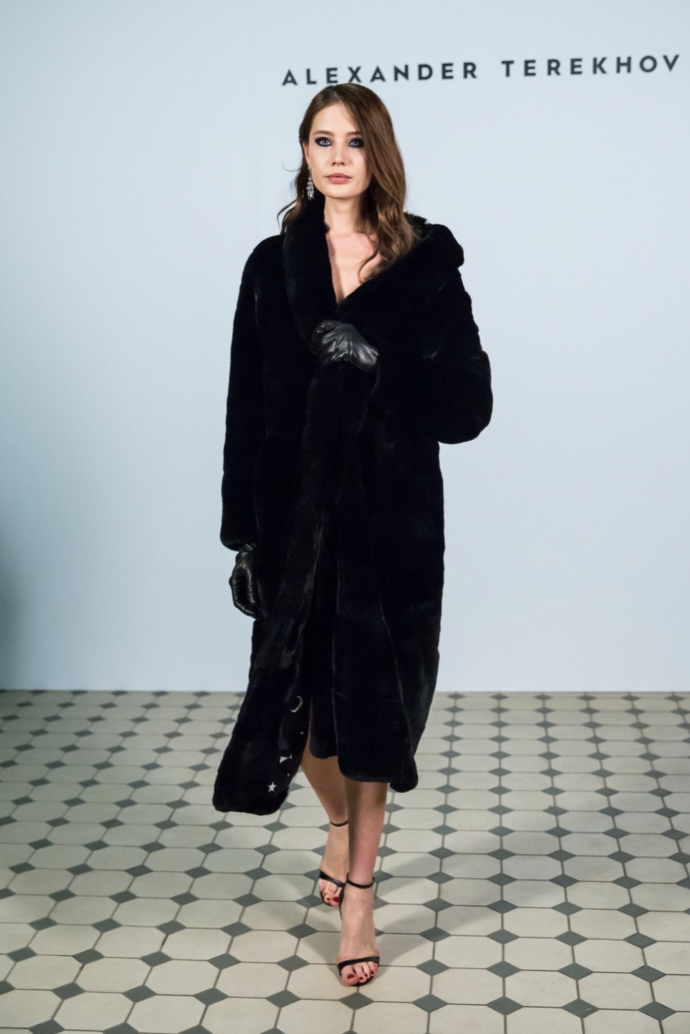 black faux-fur coat with dress