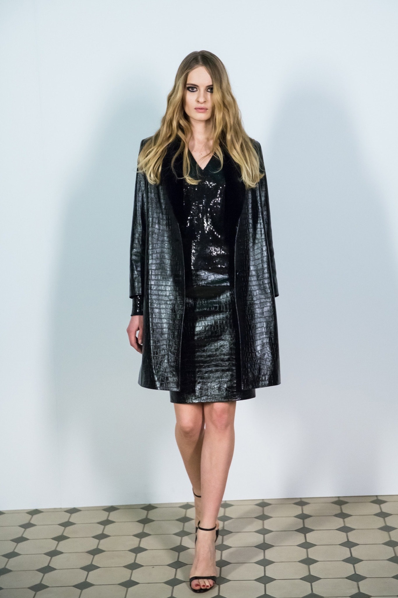 black leather coat and sequin dress