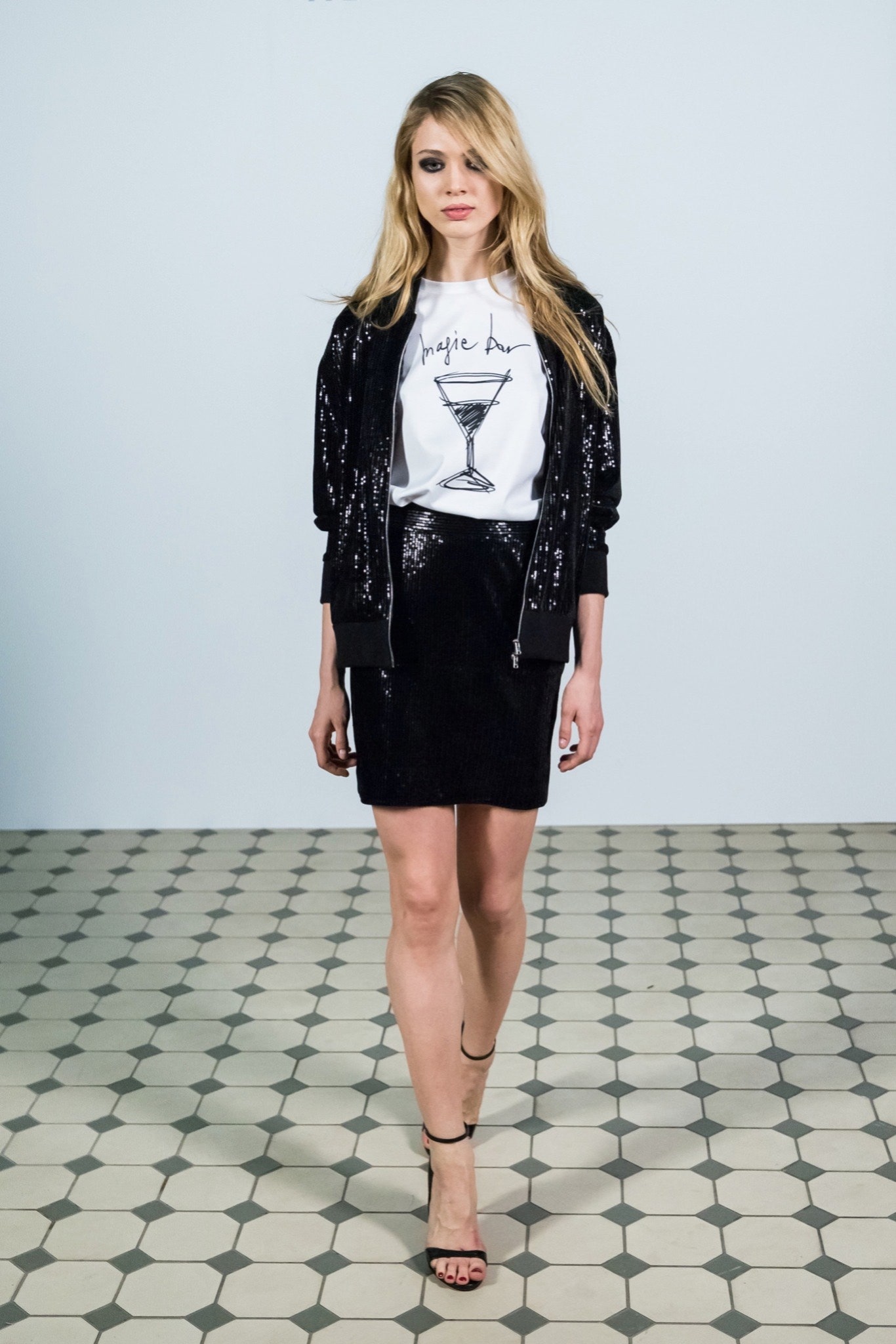 black sequin jacket with white top