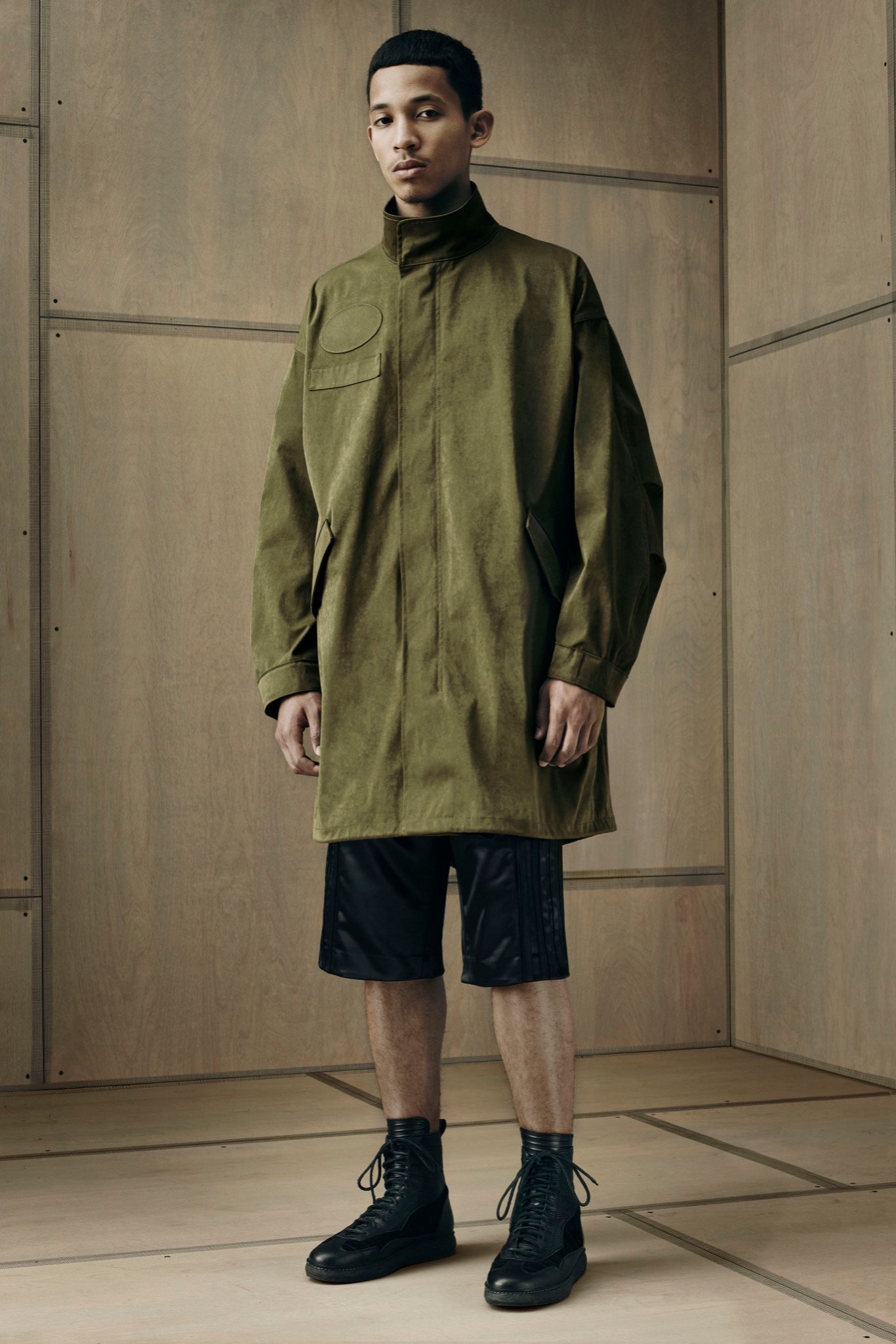 green coat black shorts outfit