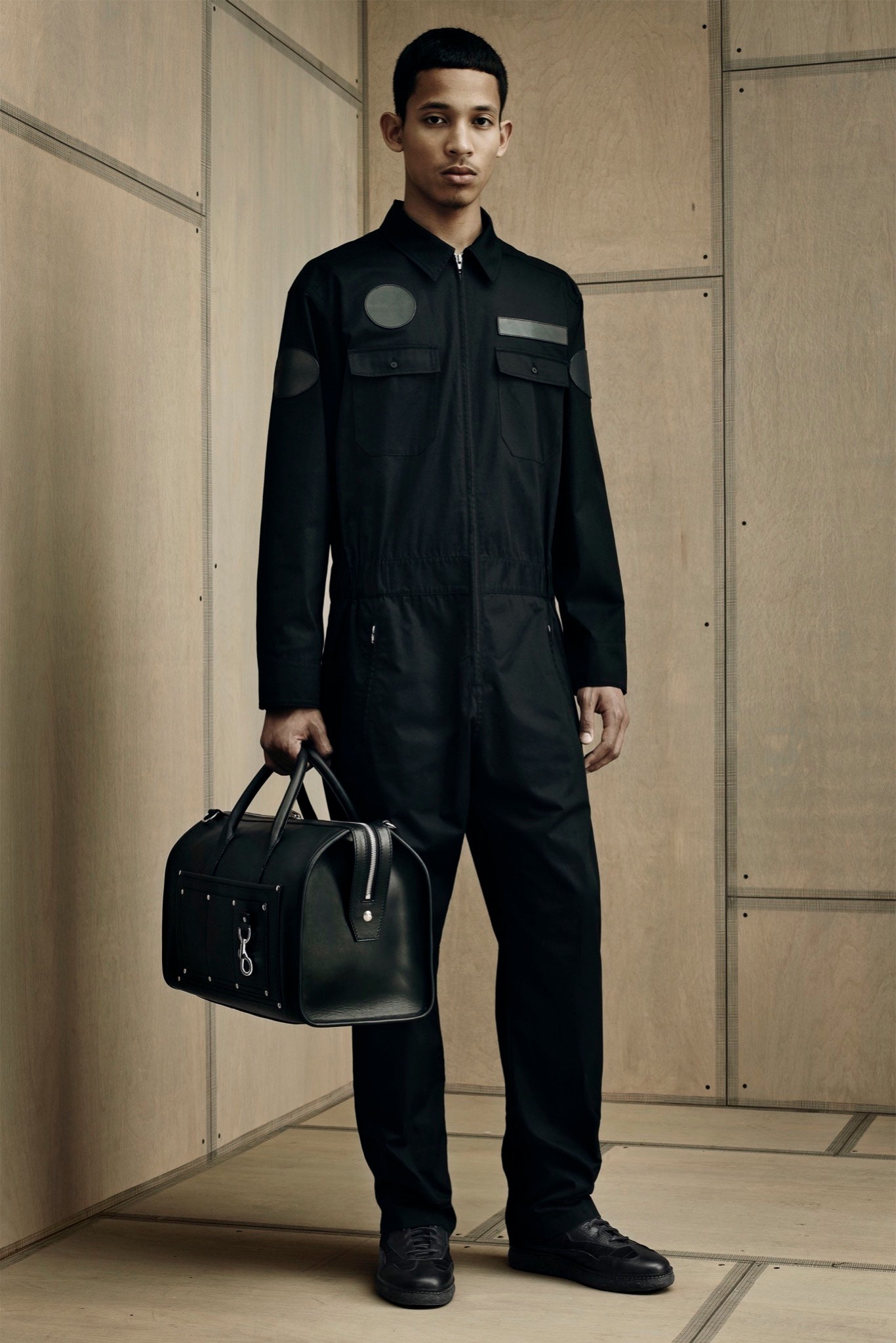 black fitted jumpsuit with bag