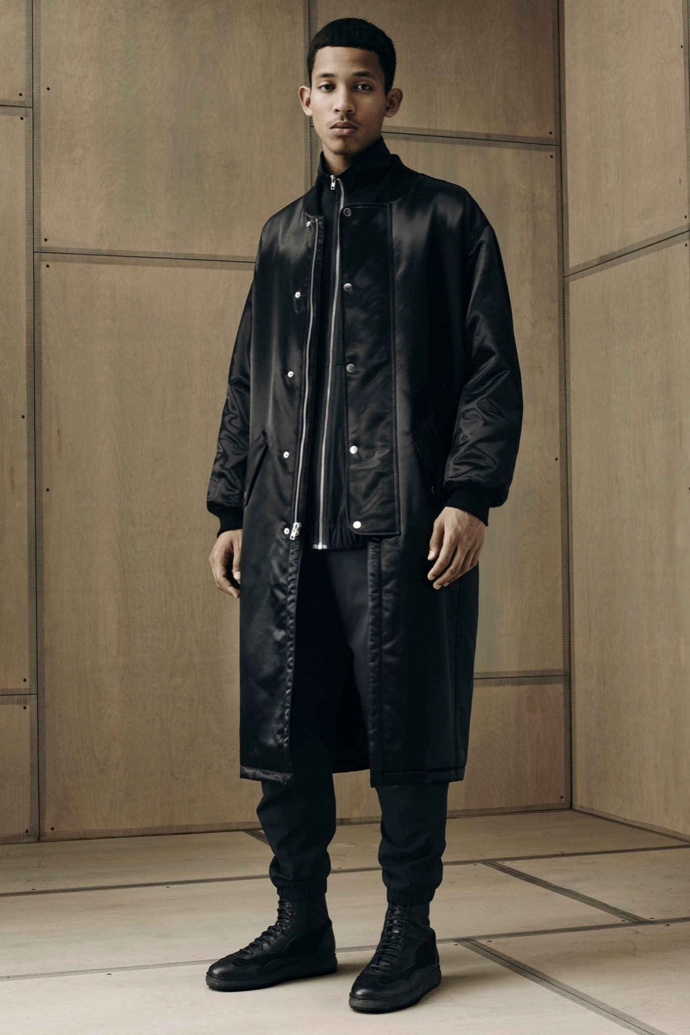 black relaxed coat with fitted pants