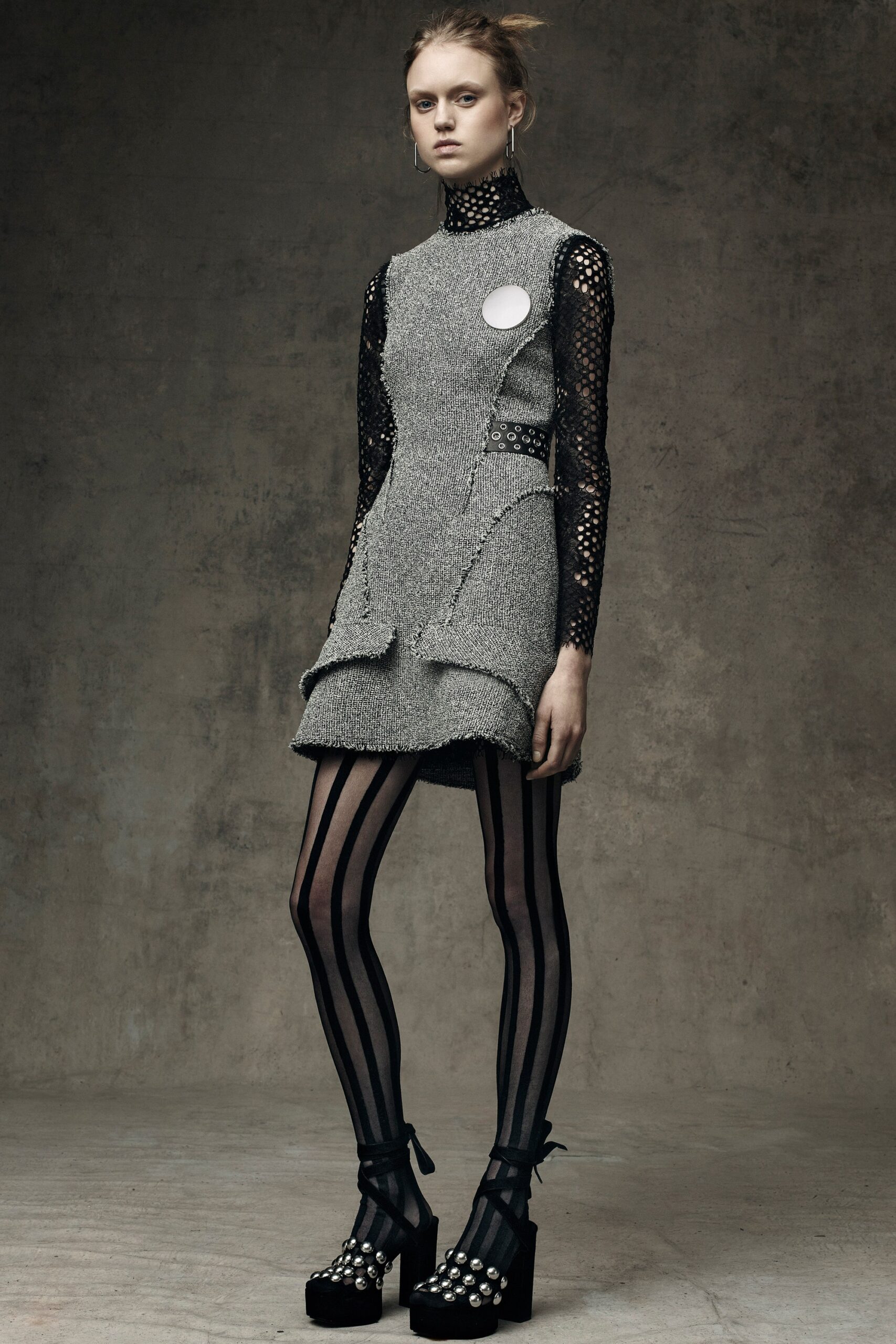 gray wool sleeveless high-neck fitted pleated pockets dress