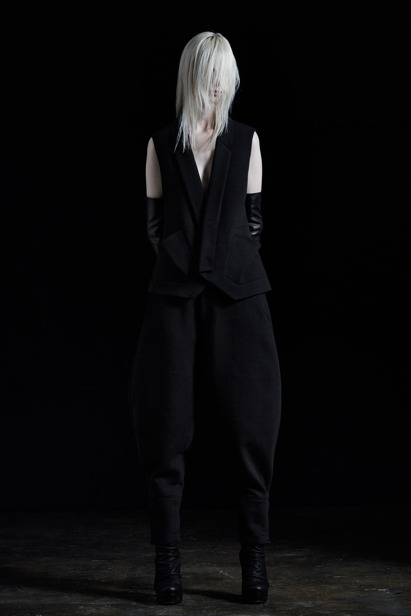 black wool vest and relaxed pants