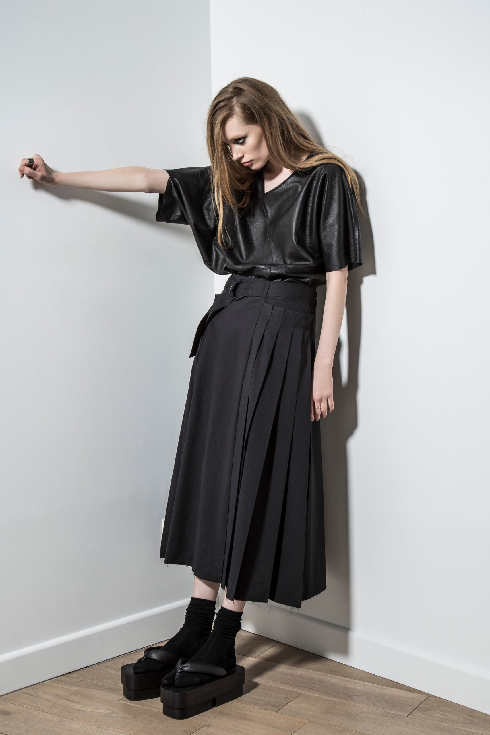 black leather top and pleated skirt