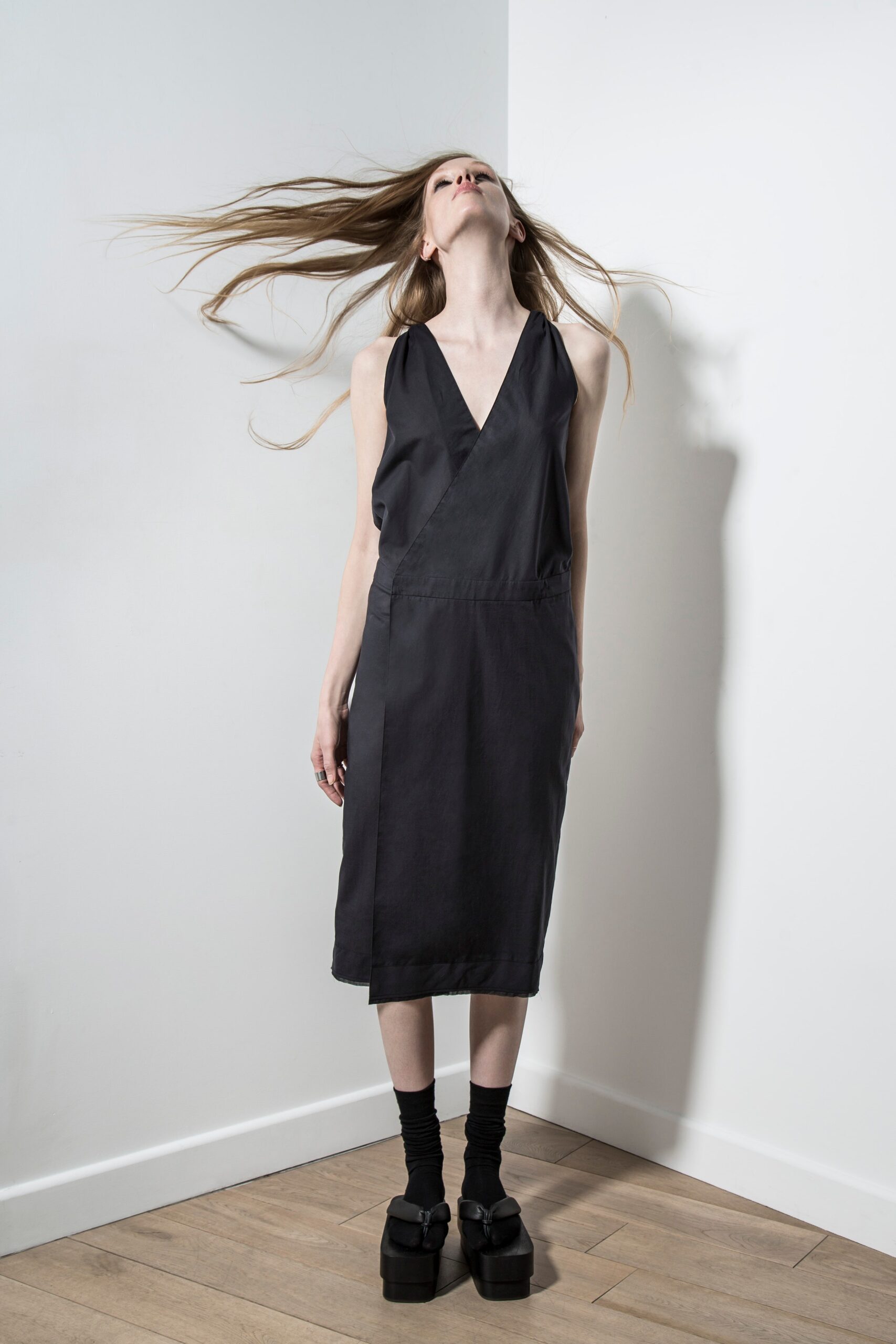 black fitted midi dress with platform shoes