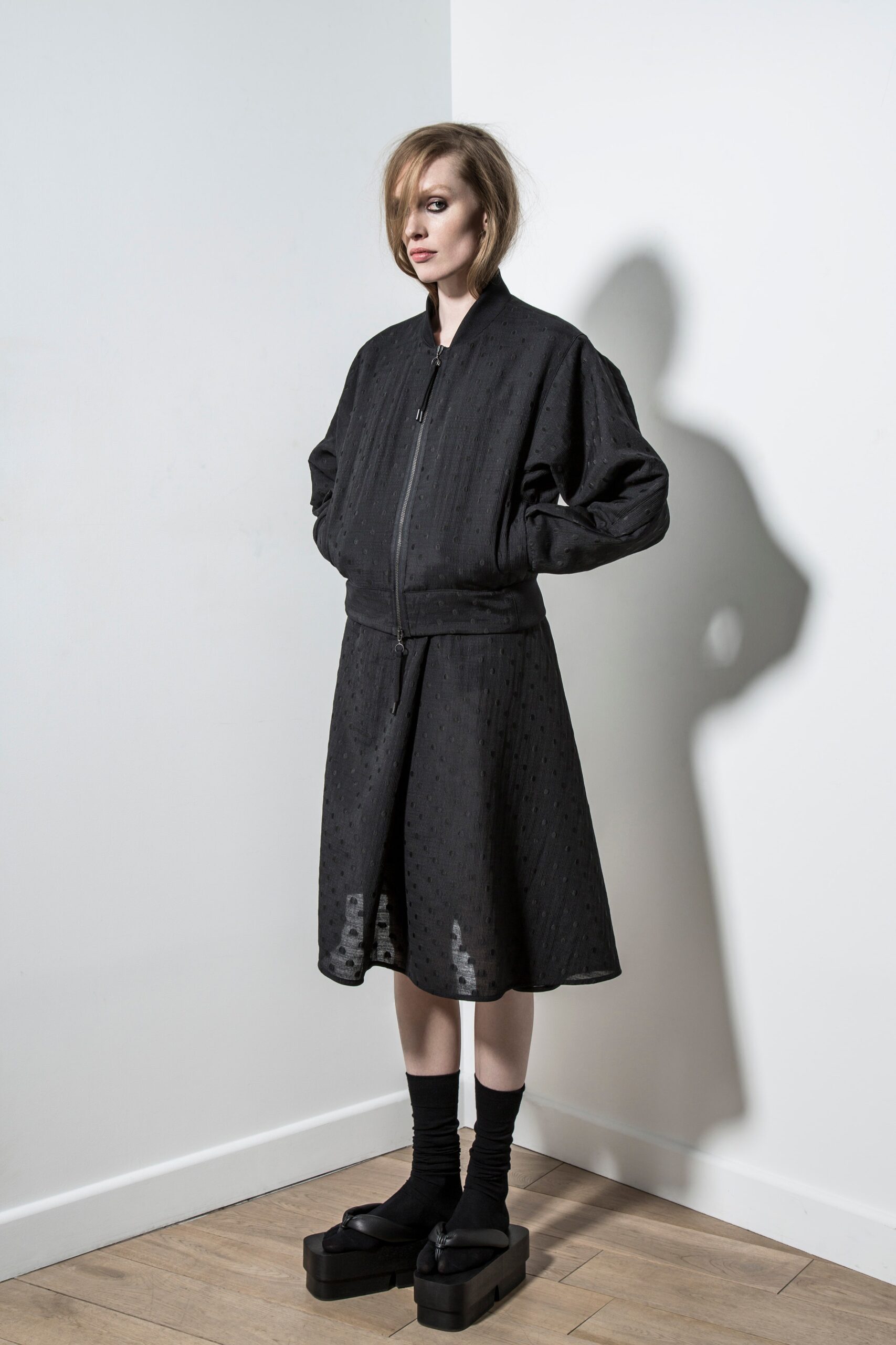 black relaxed jacket and fitted dress