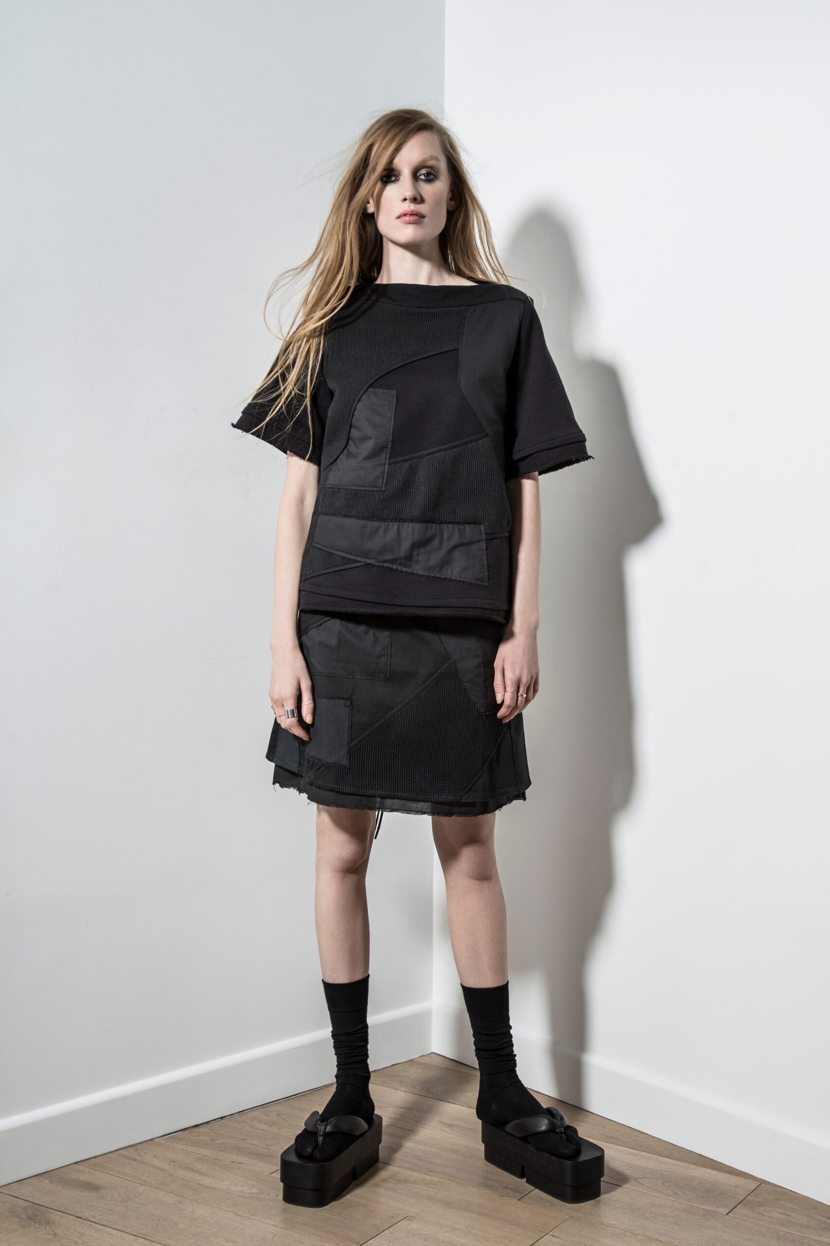 black relaxed top and fitted skirt