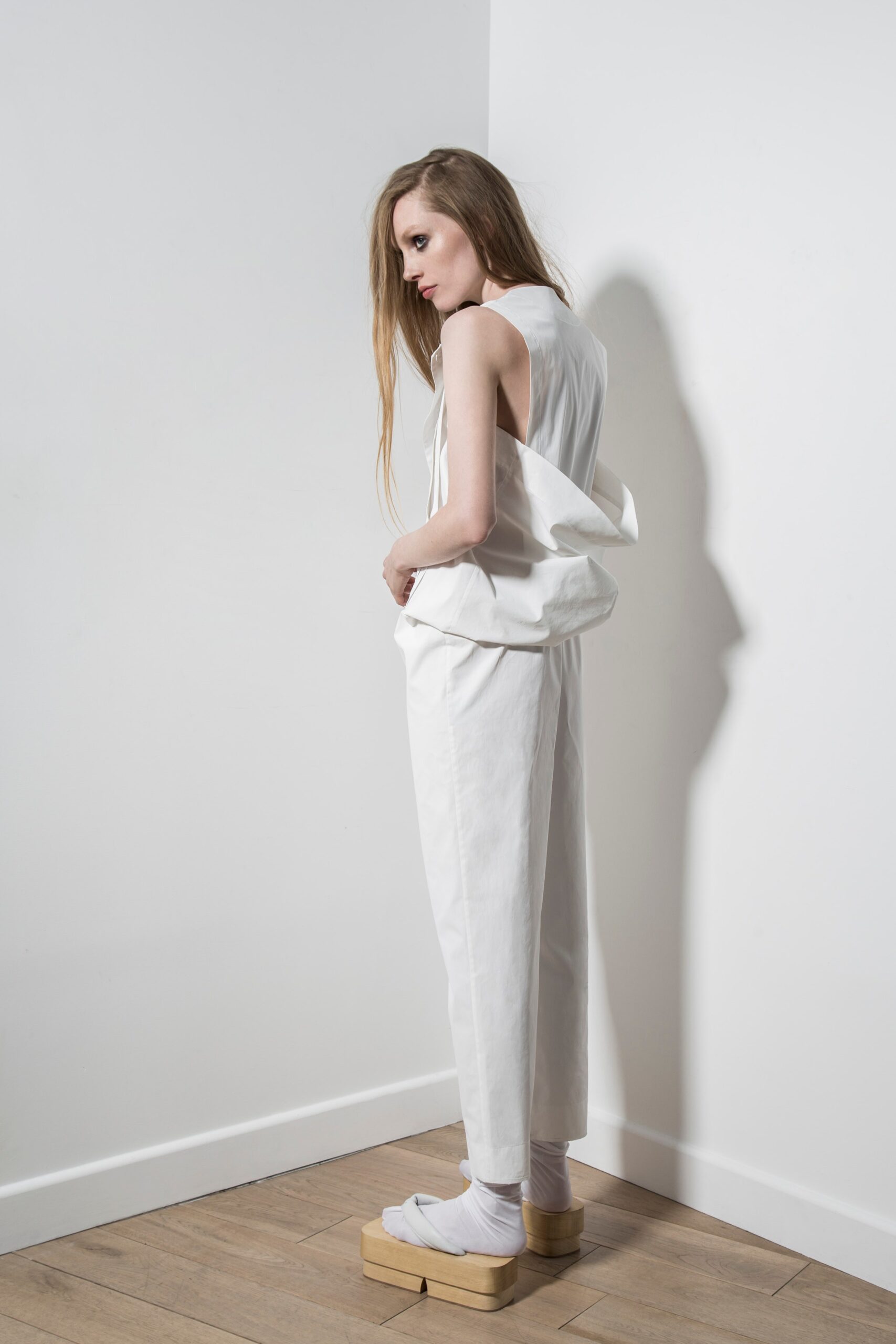 white relaxed jumpsuit with platform shoes