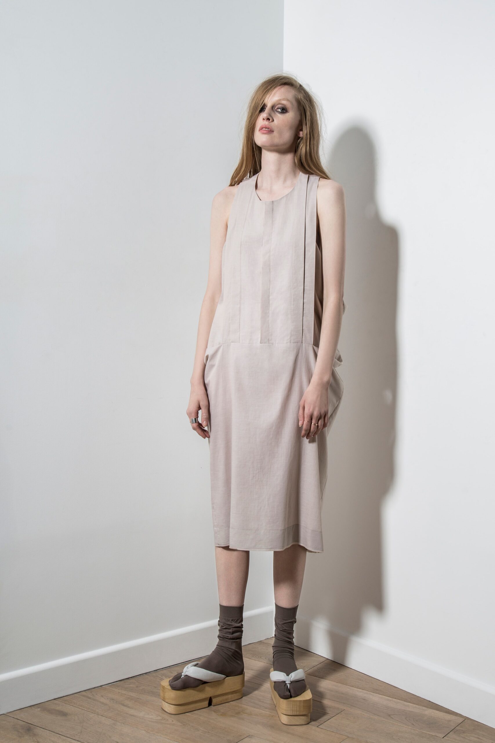 beige cotton sleeveless high-neck relaxed pleated midi dress
