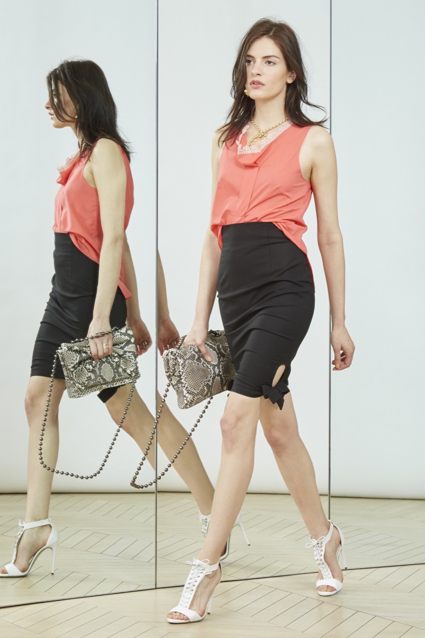 coral fitted top with black pencil skirt