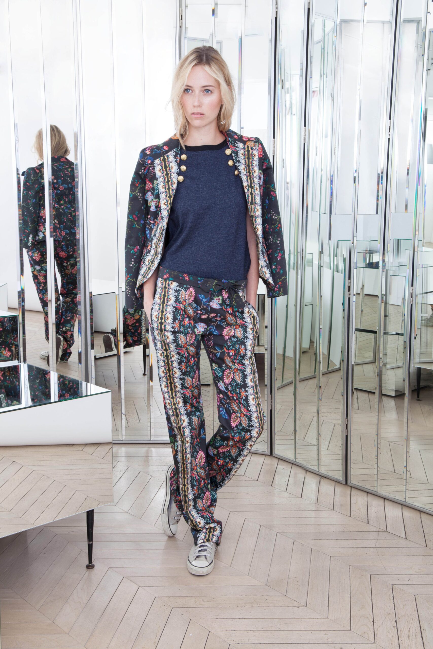 tailored black embroidered jacket with relaxed blue top