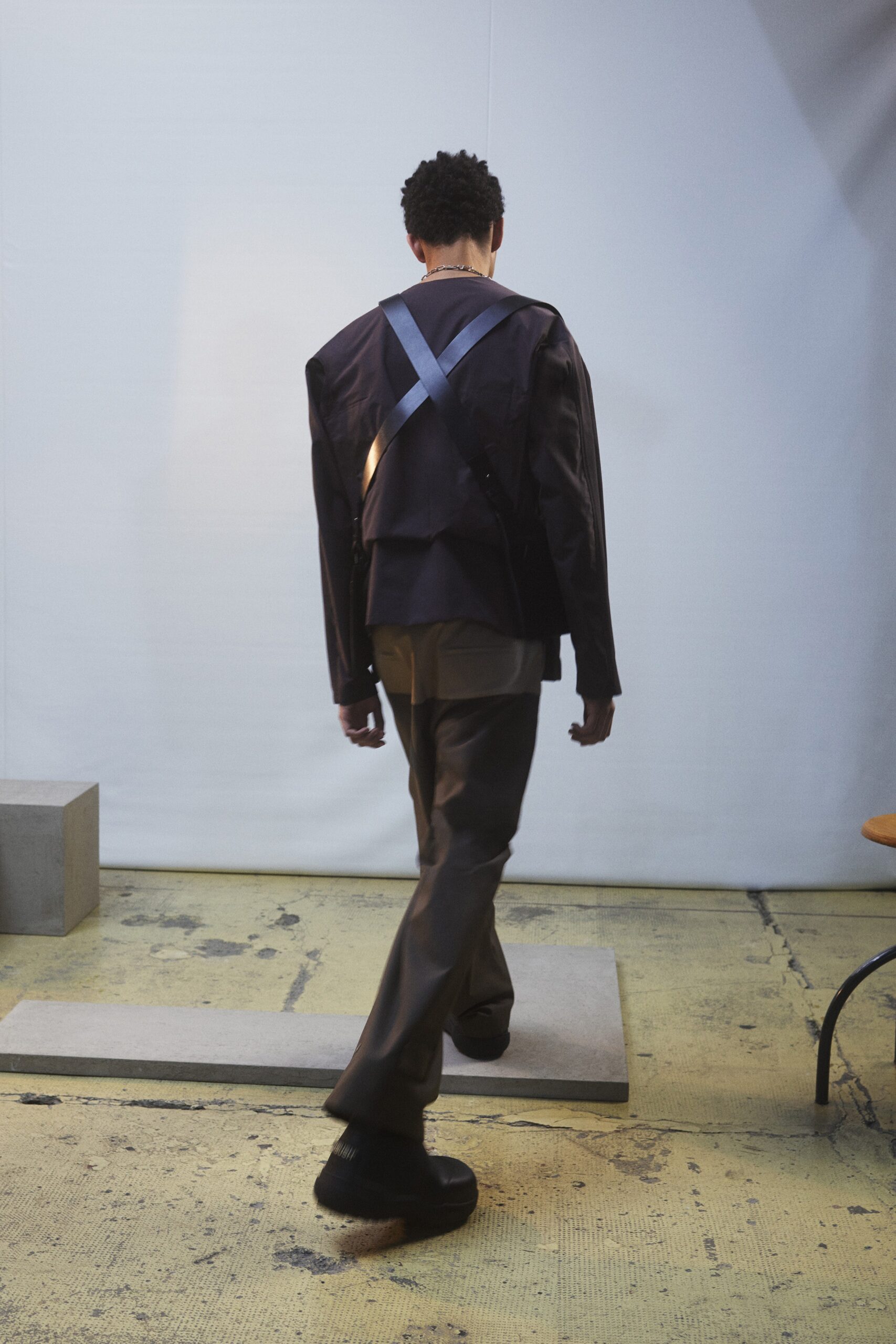 black relaxed jacket with brown tailored pants