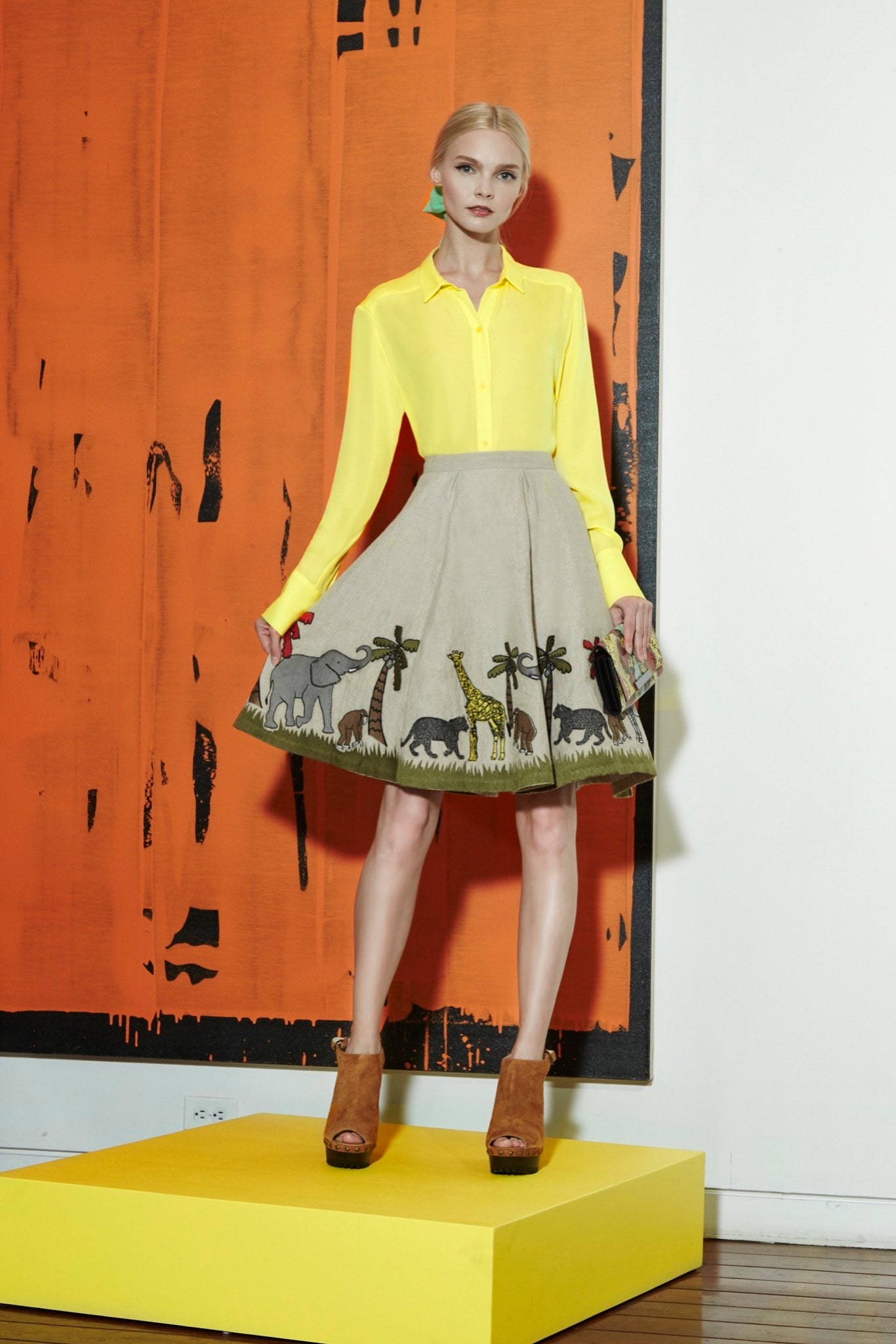 yellow collared shirt and beige embroidered skirt