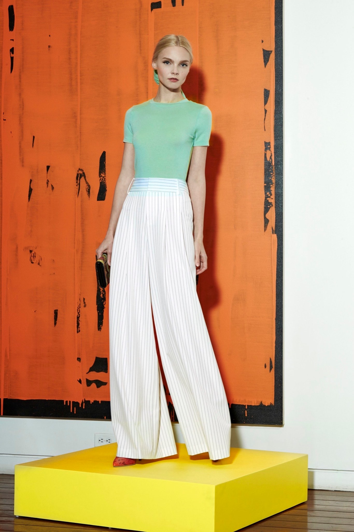 fitted green top and striped pants