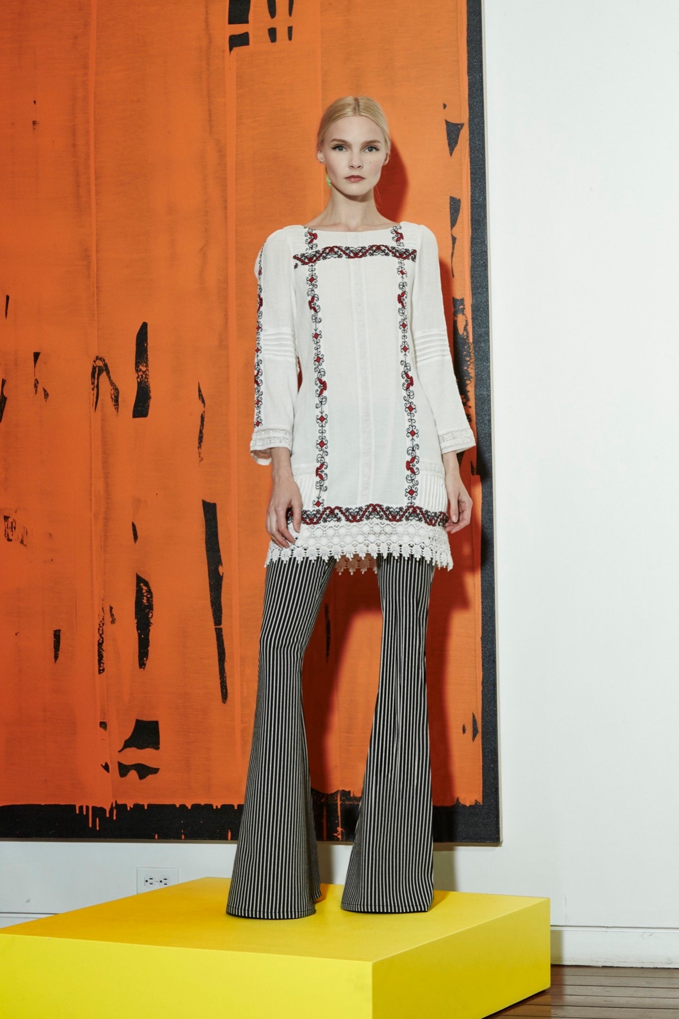 white embroidered blouse with flared pants