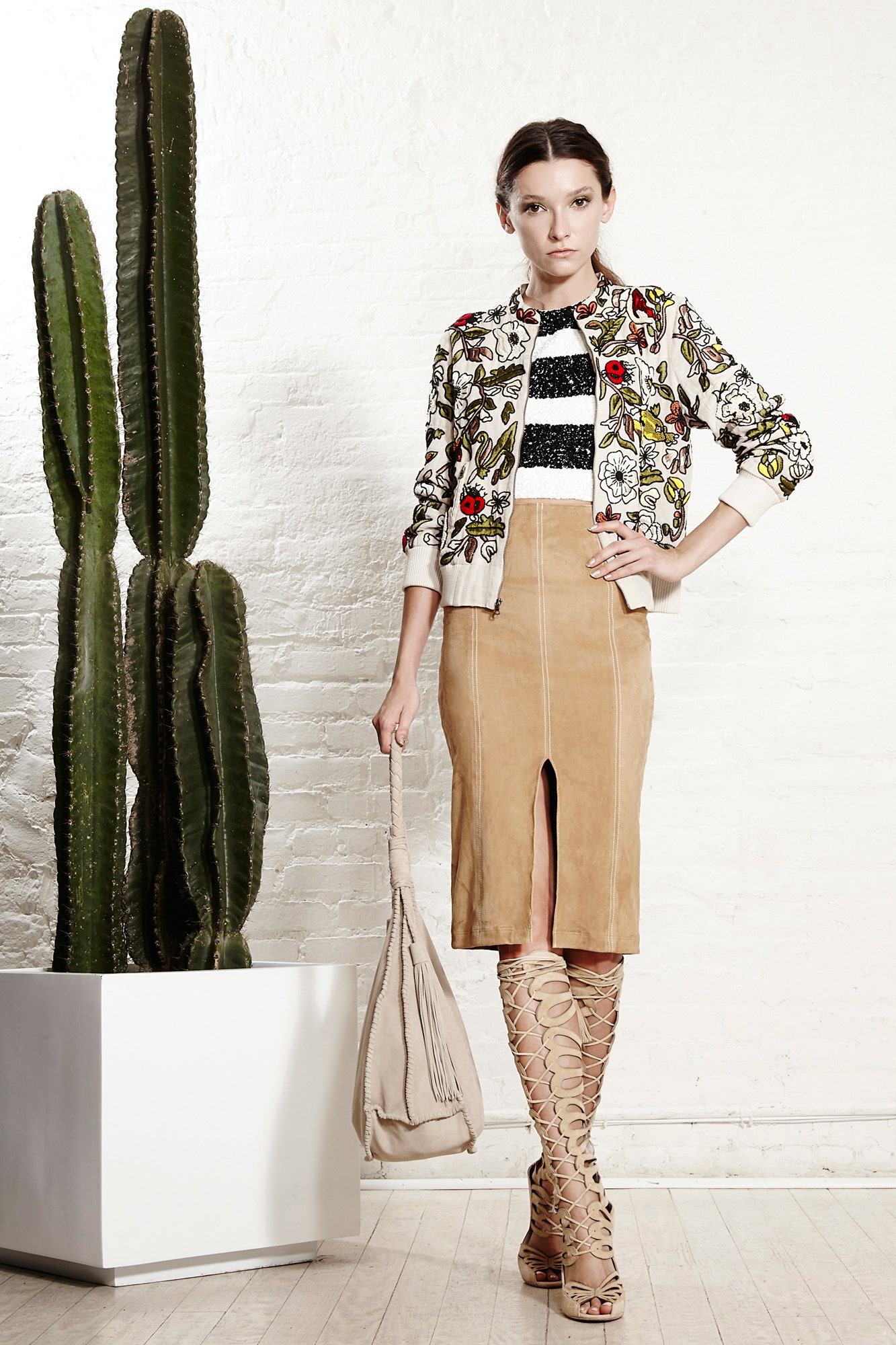 embroidered jacket with beige skirt