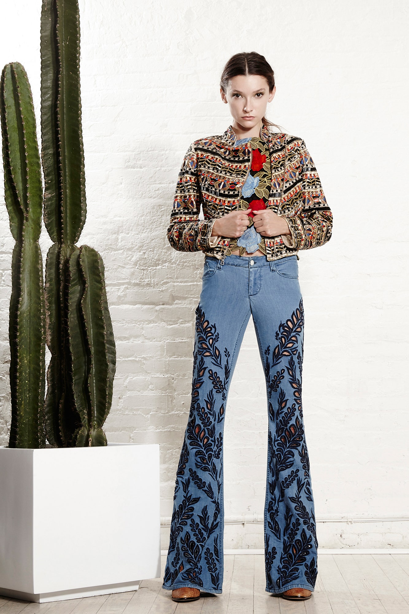 embroidered multi-colored jacket and flared denim pants