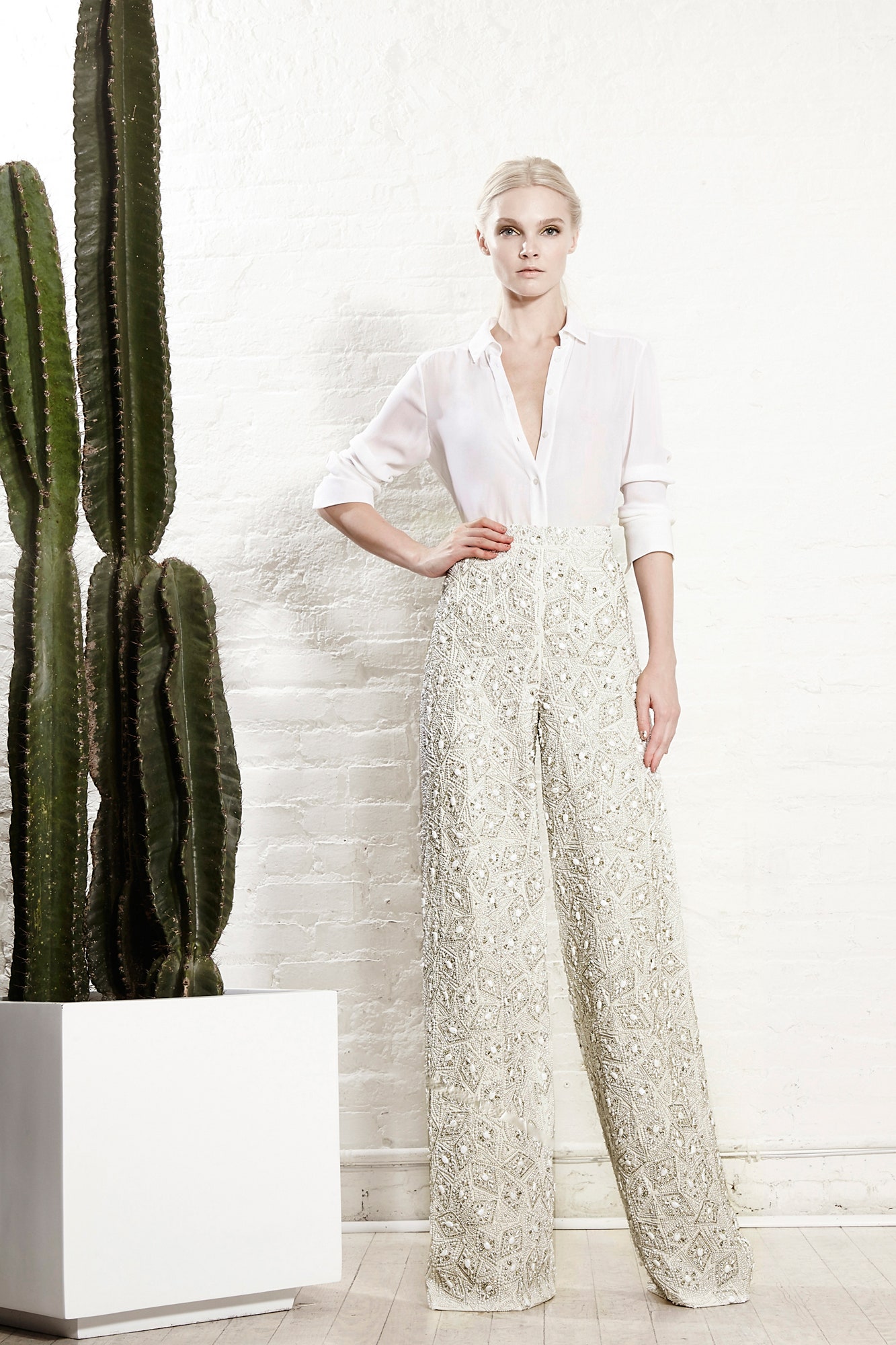 white shirt and beige embellished pants