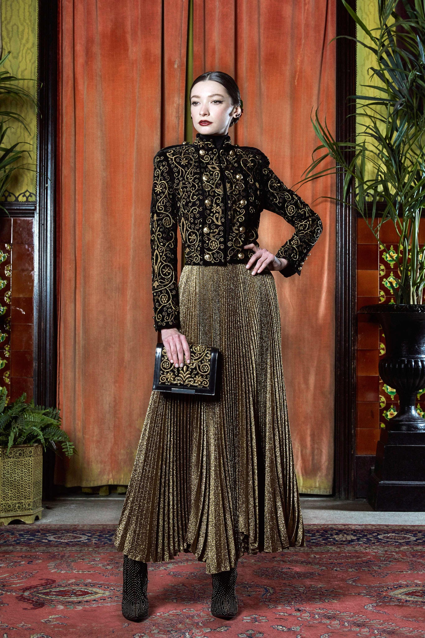 black velvet blouse with gold pleated skirt