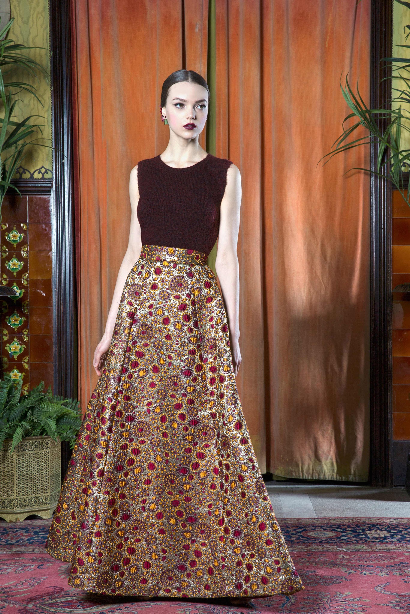 brown wool sleeveless top and gold skirt