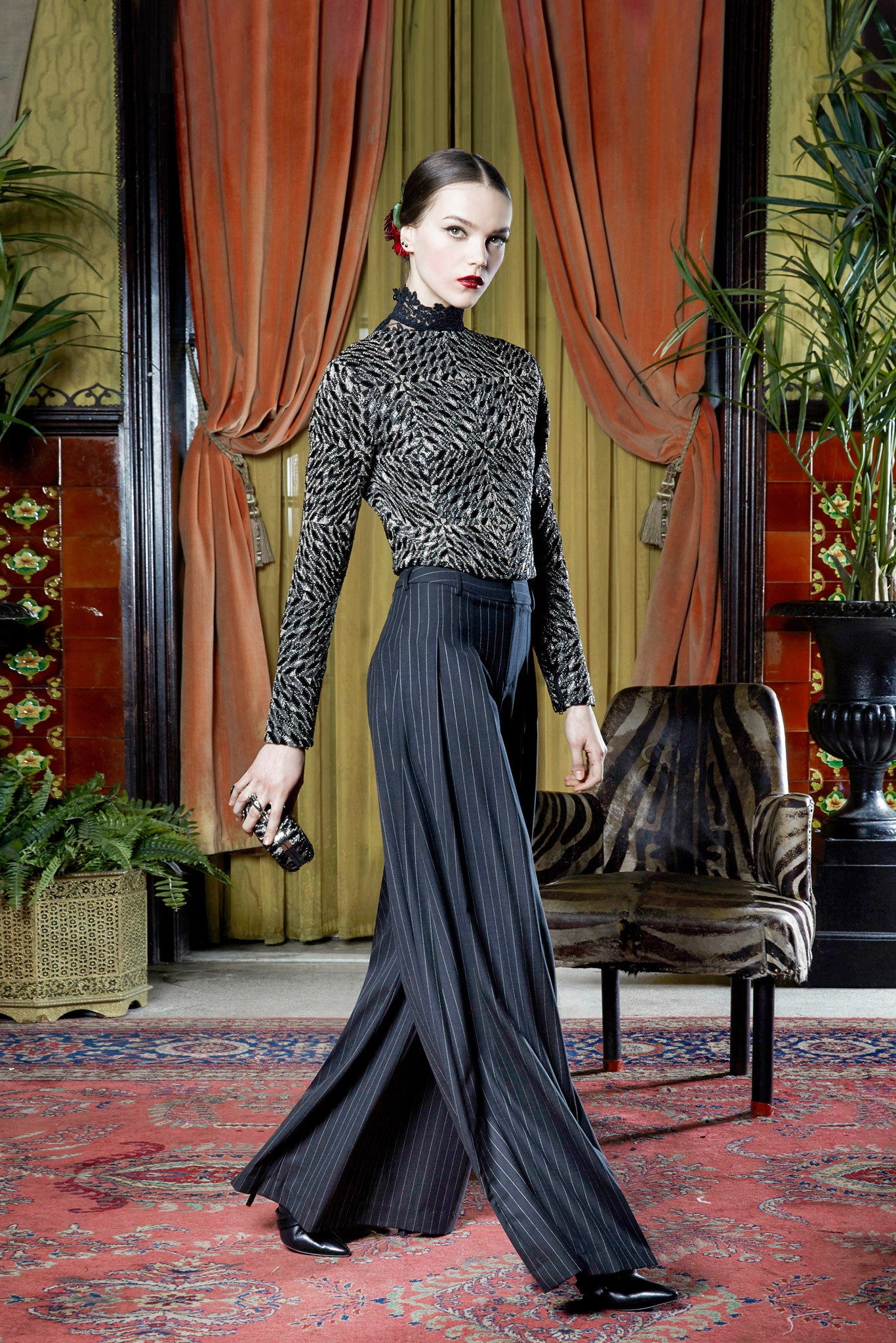 black and gold embroidered top with wide-leg pants