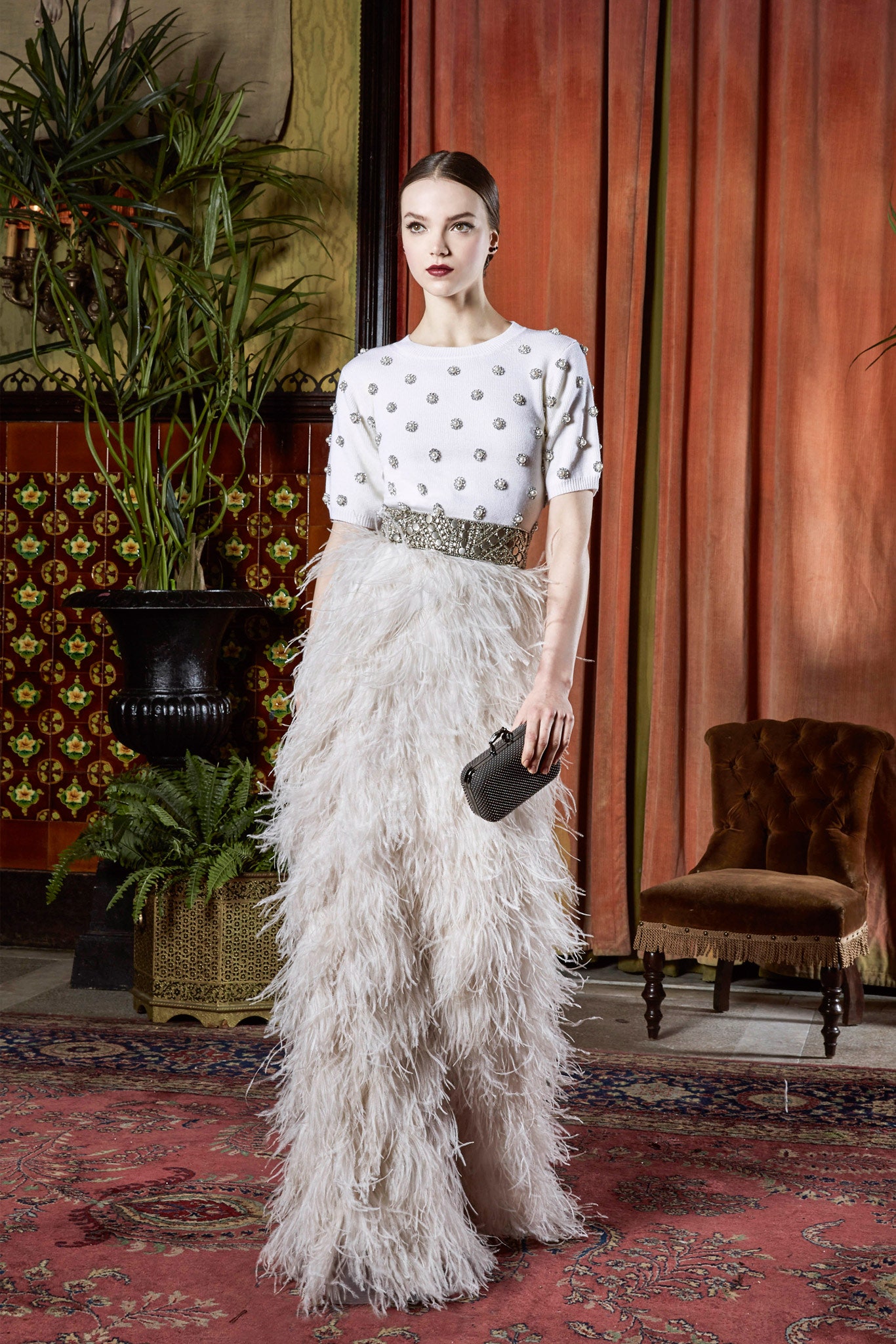 white beaded top with feather gown