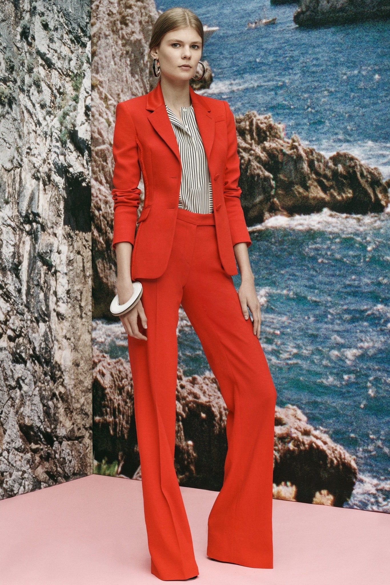 red long-sleeve collared fitted flared suit