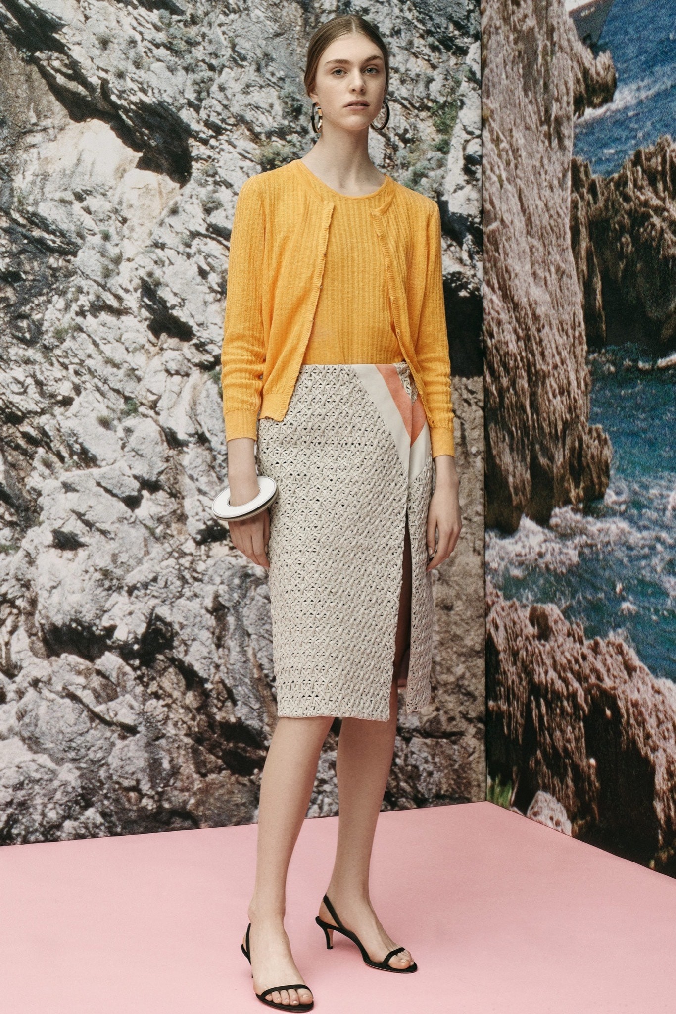 yellow fitted cardigan and beige pencil skirt