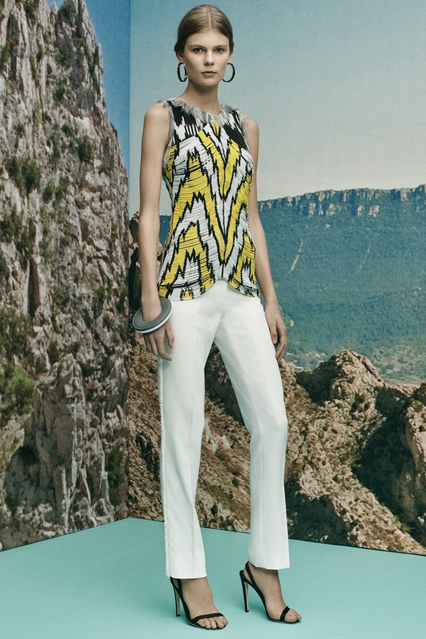 yellow sleeveless fitted printed top
