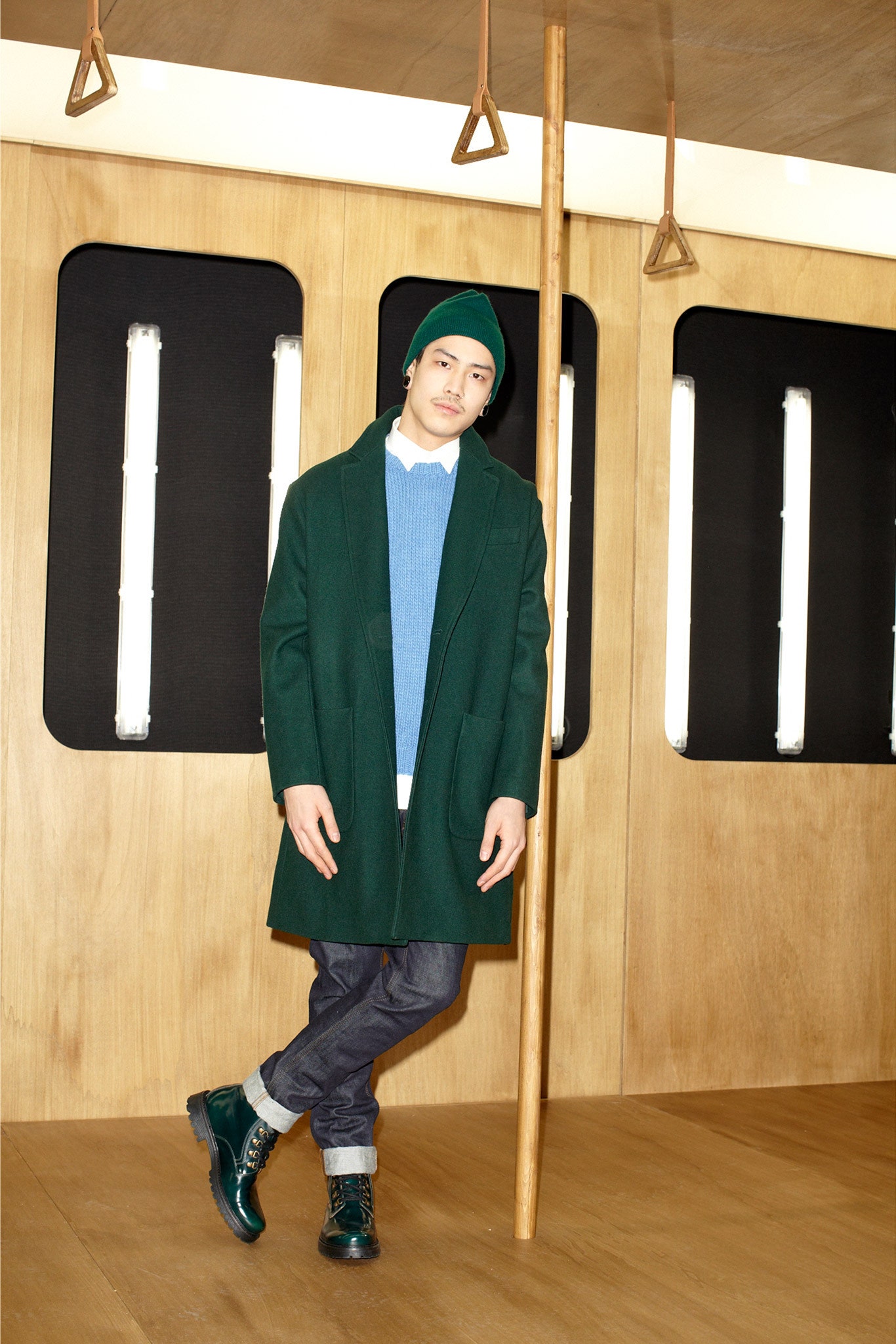 green wool coat with blue sweater