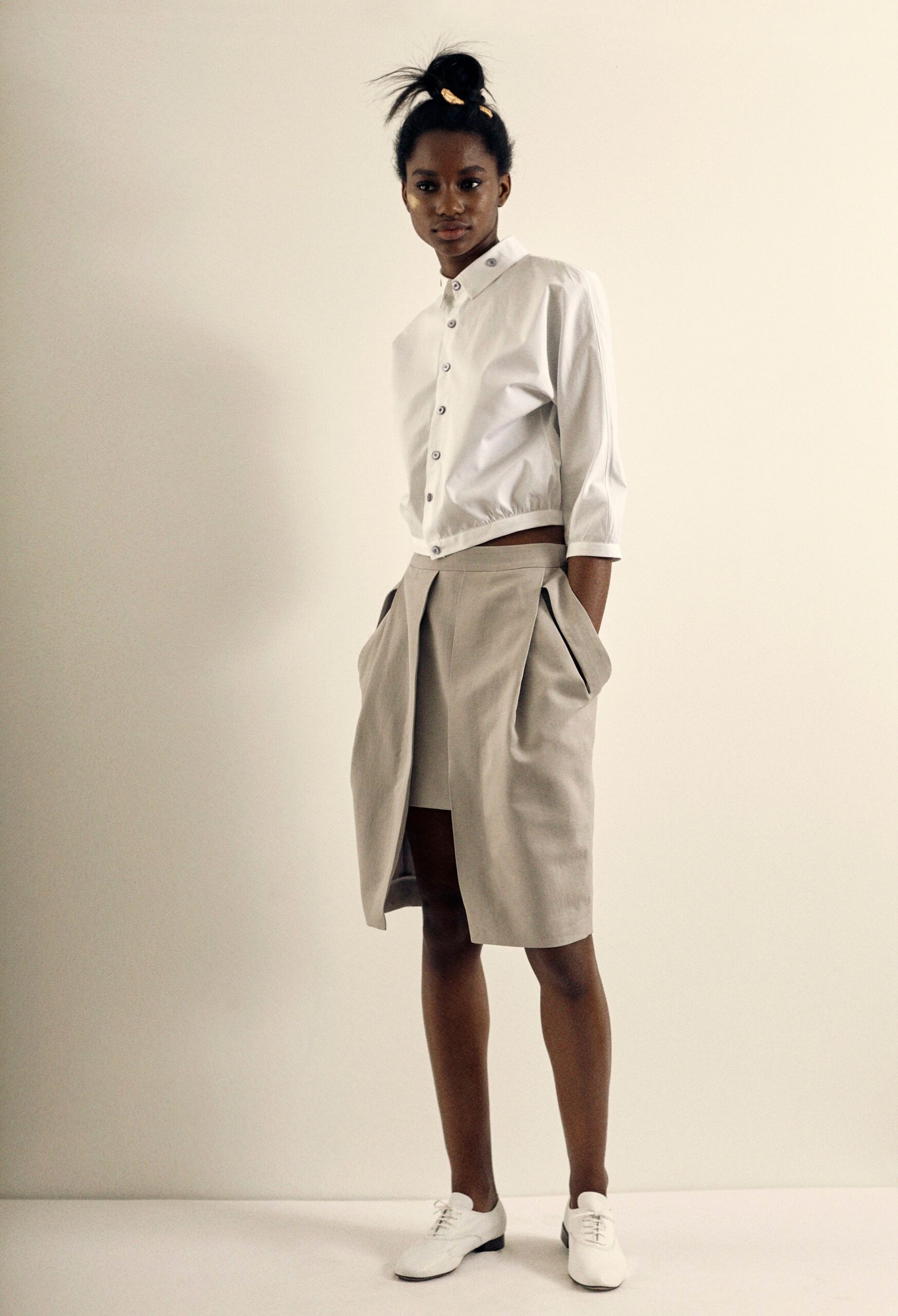 white fitted shirt and beige skirt