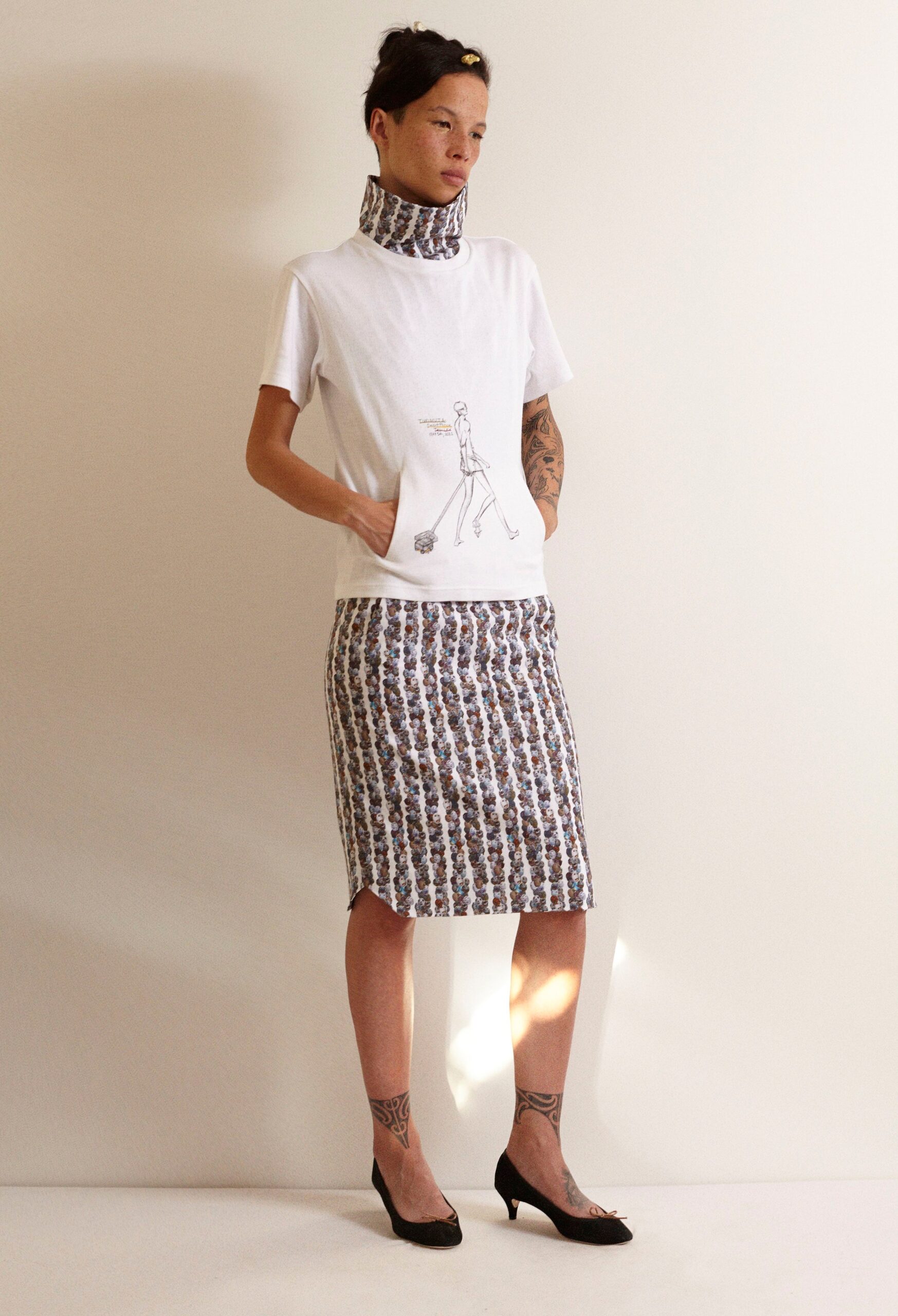 white relaxed t-shirt and multi pencil skirt