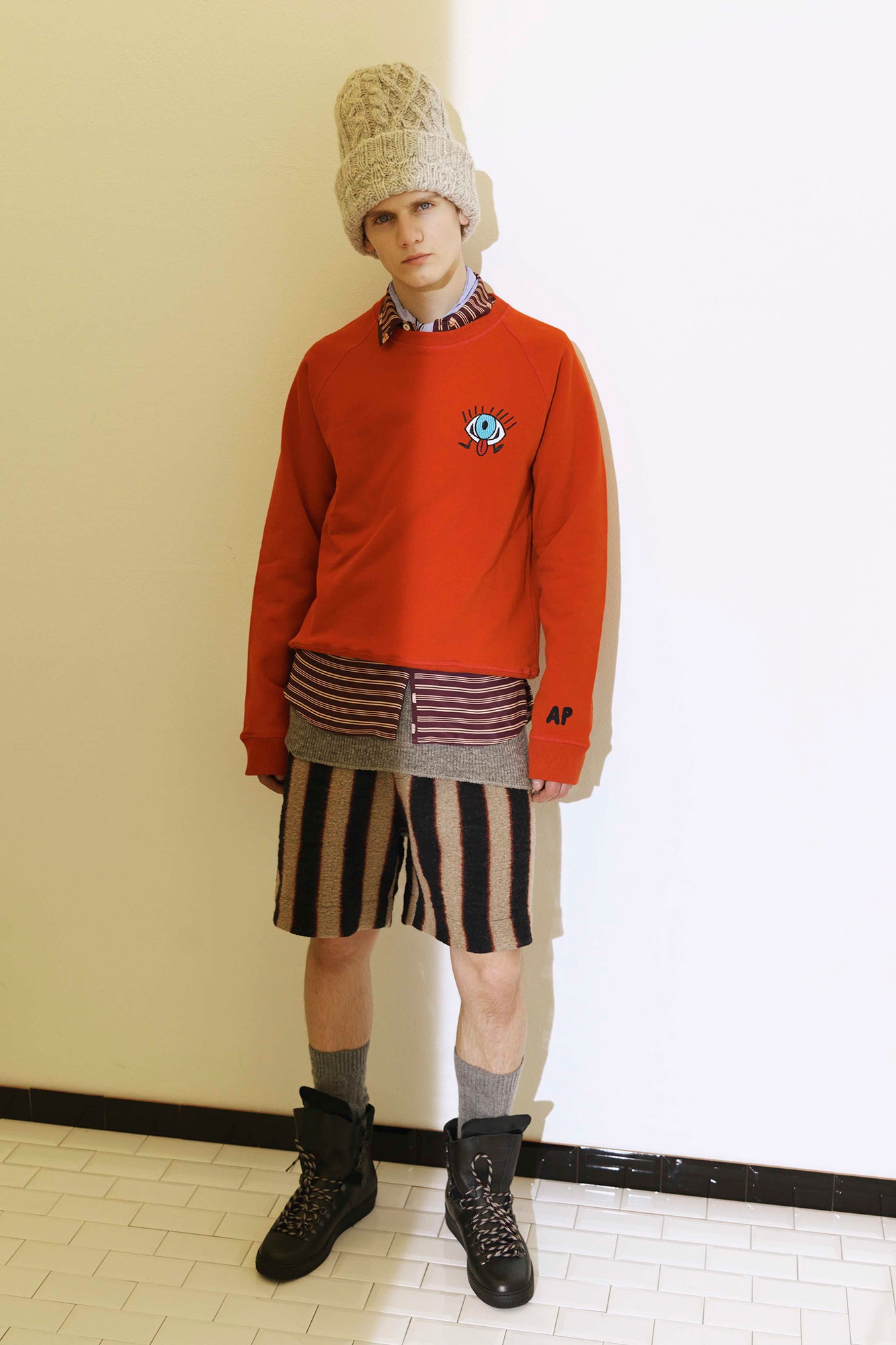 red relaxed sweater with striped shirt