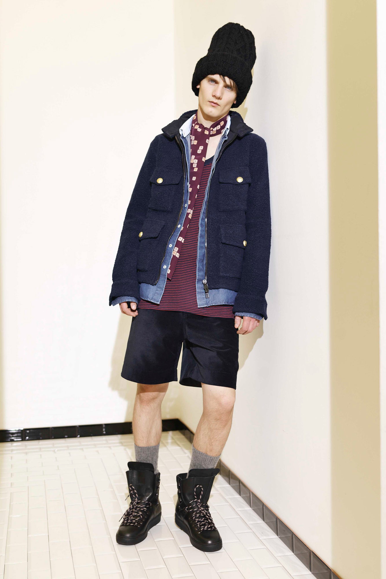 blue jacket with black shorts