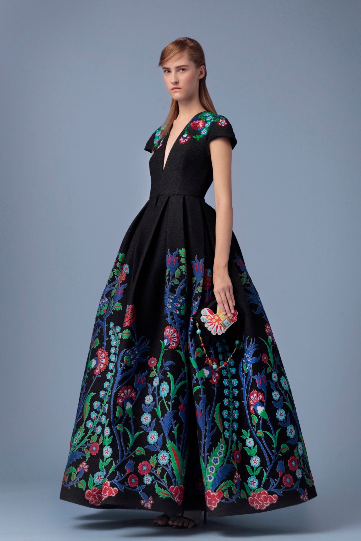 black embroidered gown with clutch