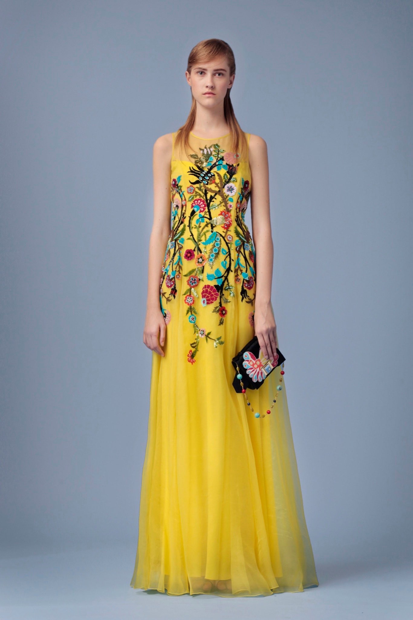 yellow silk sleeveless high-neck fitted embroidered flowing gown