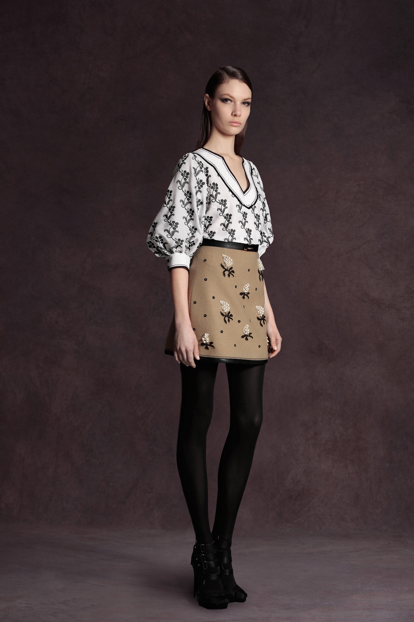 white embroidered blouse and beige mini skirt