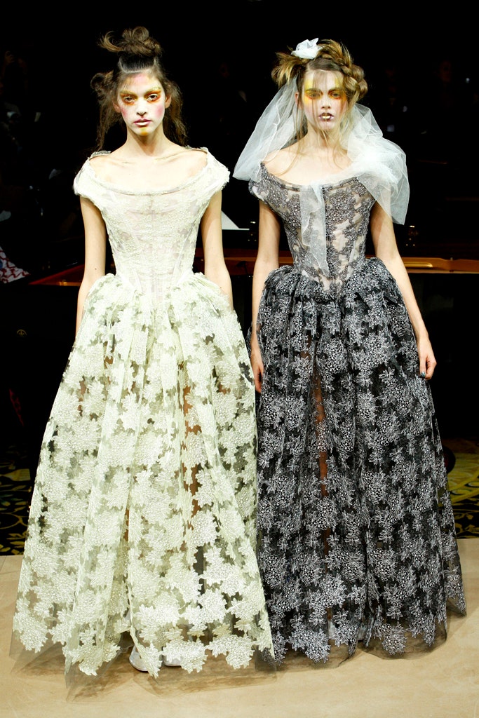 white lace sleeveless high-neck fitted flared flowing gown