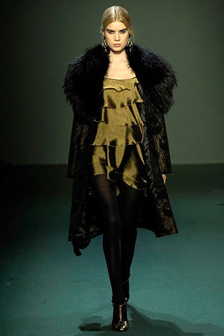 gold ruffled mini dress with black coat