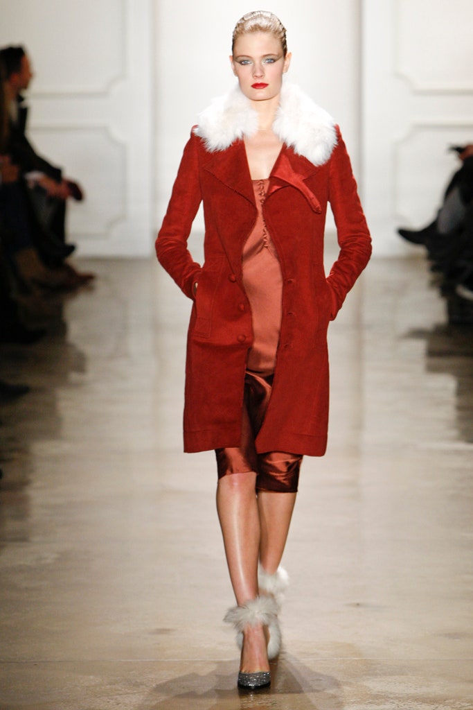 red suede coat with orange dress