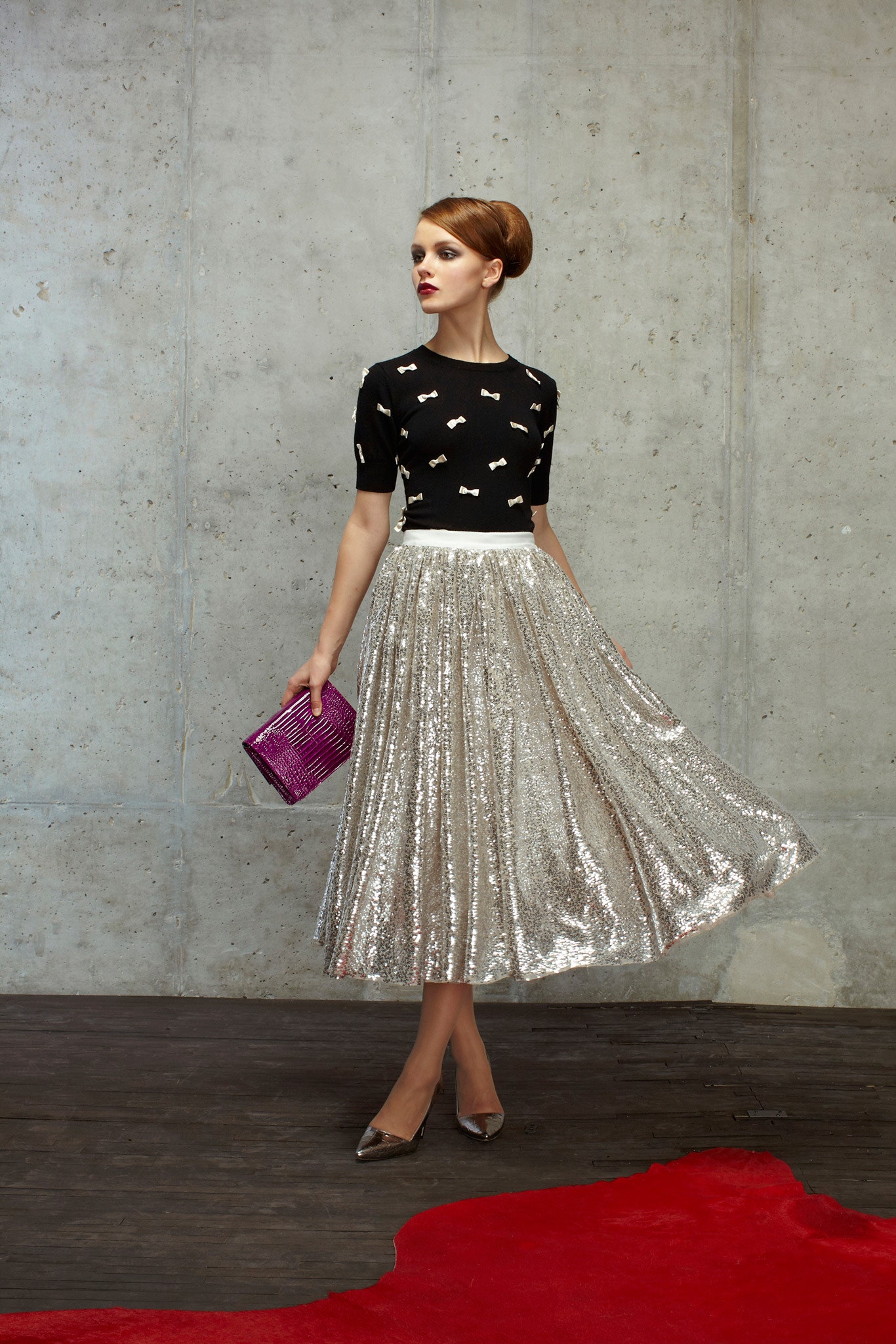 black fitted top with silver pleated skirt