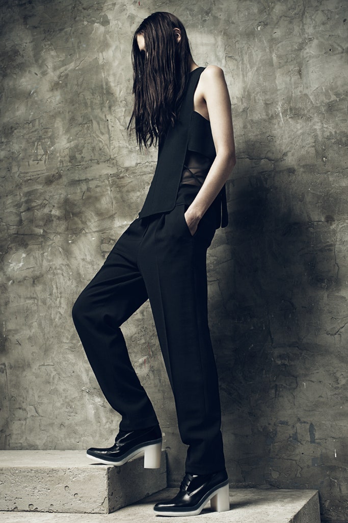 black fitted top and tailored pants