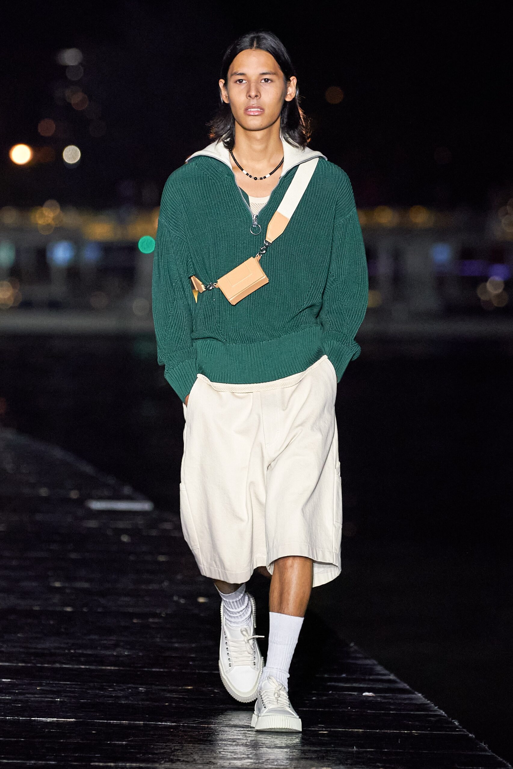 green relaxed sweater with white shorts
