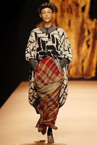black and white printed cape with pleated skirt